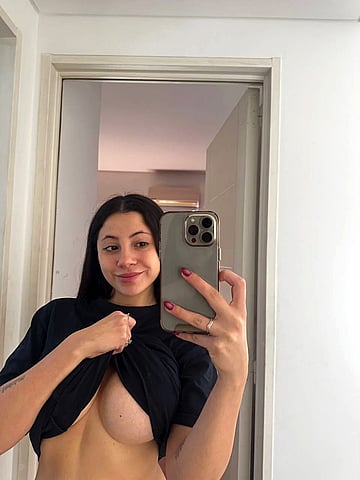 Check out my massive natural tits about to burst out for you, you horny fuckers!'